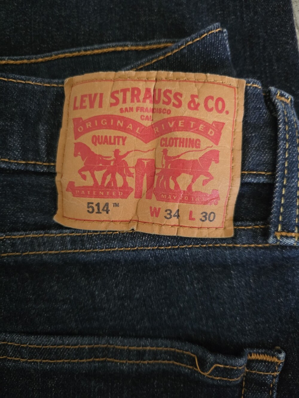 Levi's Men's Slim Straight Jeans in Dark Blue with Tan Patch
